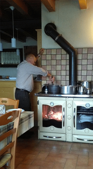 Grandpa Adeodato and the cooking of polenta taragna on a fire stove - Winter 2016 - ICAP Services